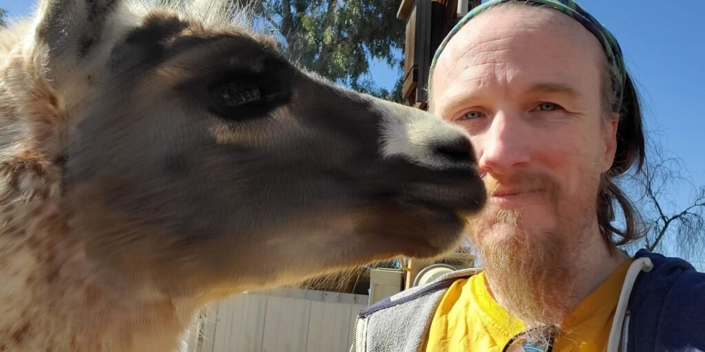 Craig Wescoe with a llama