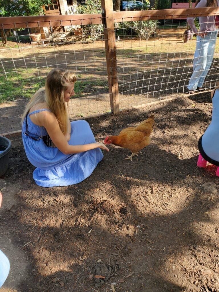 Bailey Jo Hall with a hen